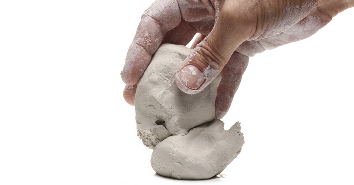 Hand reshaping clay