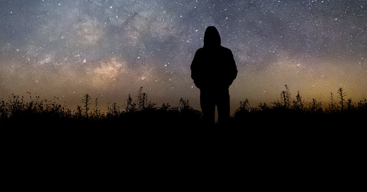 Silhouette man looking milky way in summer night