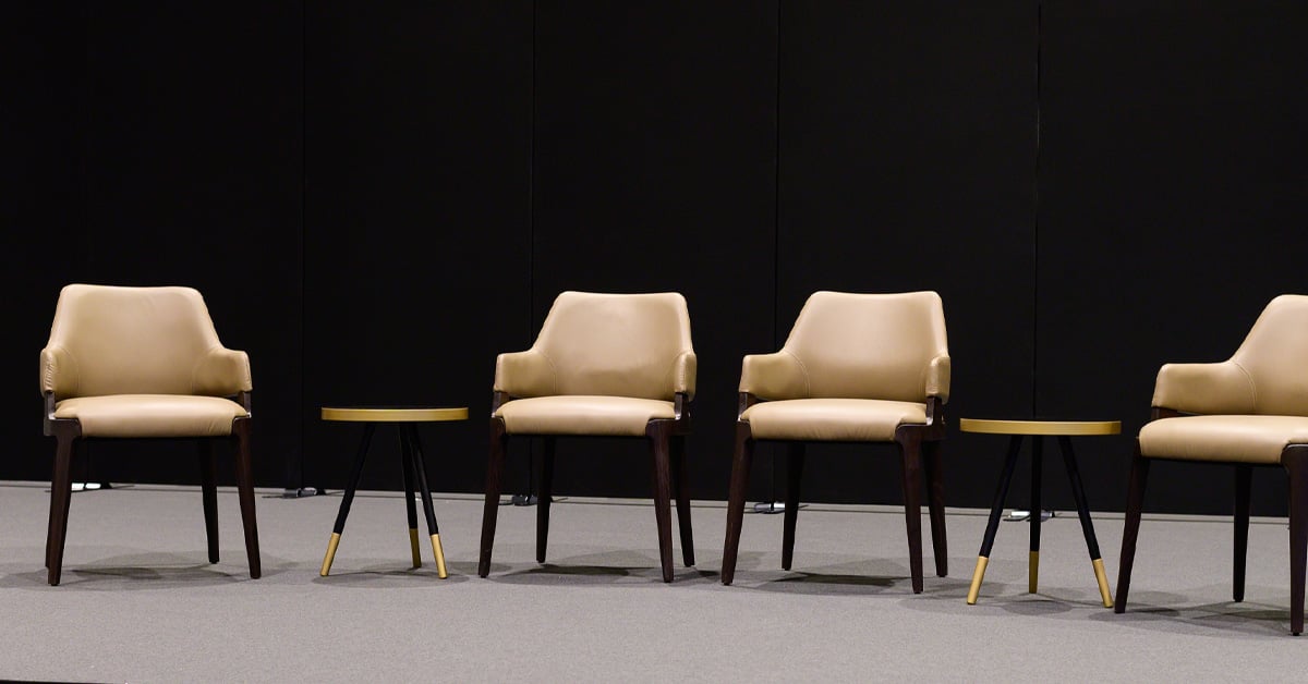 Empty chairs on stage