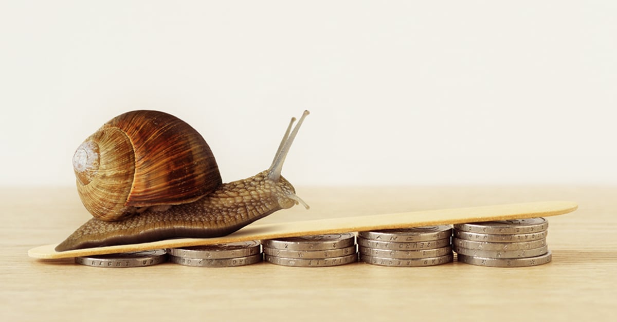 Snail climbing piles of coins